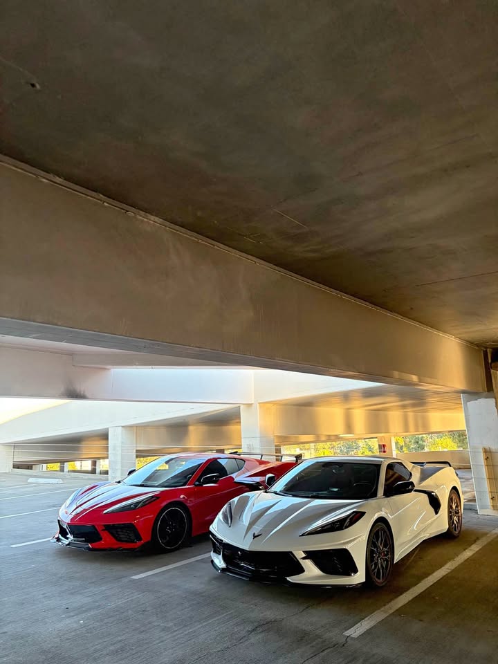 The red and white 2024 Corvette Stingrays of the Z ERB Exotics fleet parked side by side